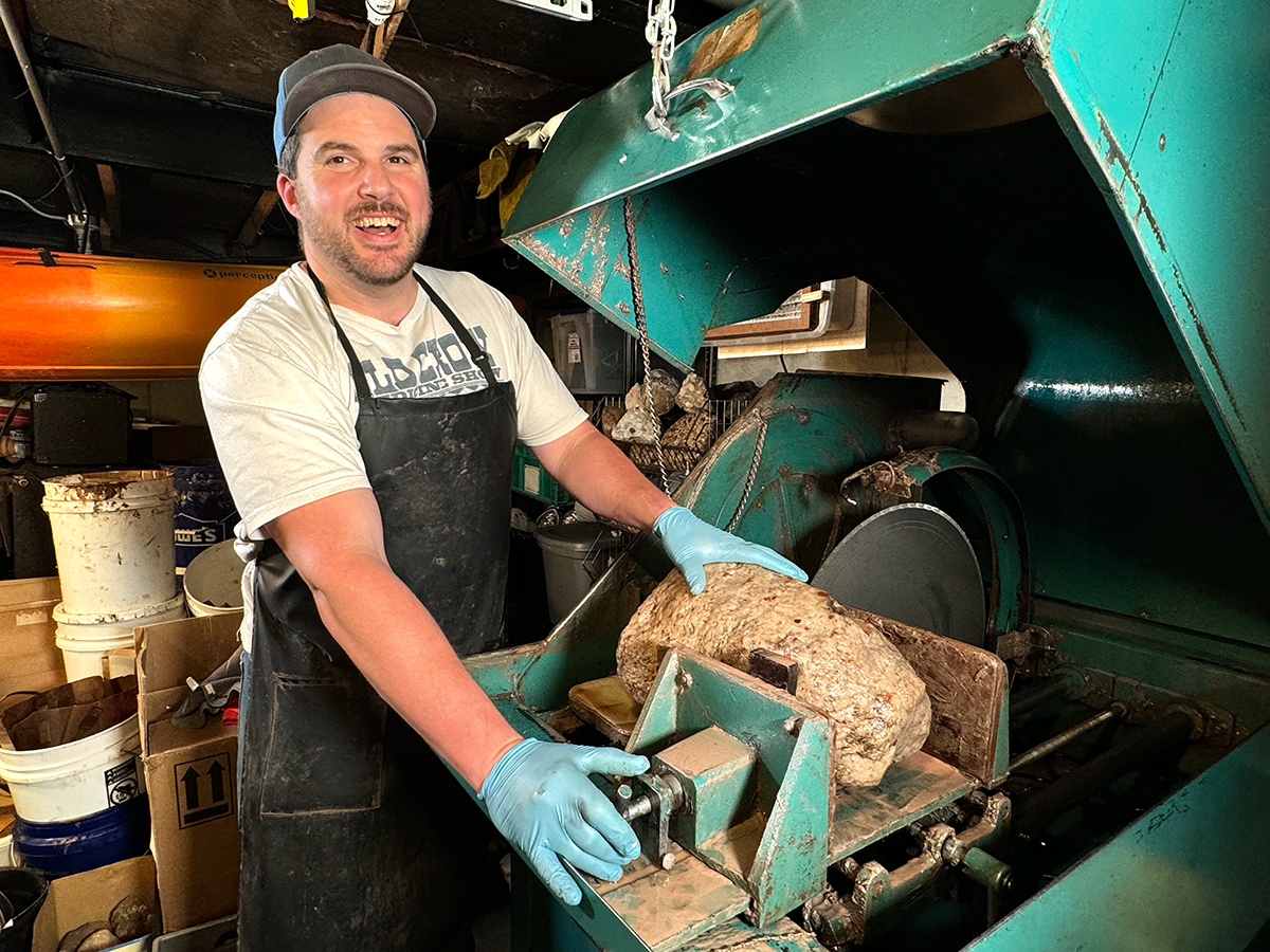 Matt cutting a Puddingstone in his large saw