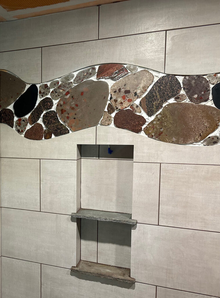 Custom shower tiles made from Puddingstone